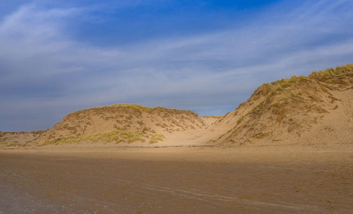 Scenic view of desert against sky