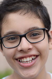 Close-up portrait of smiling young woman
