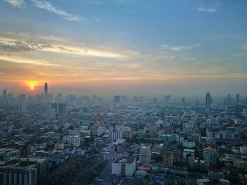 Cityscape against sky during sunset