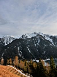 Scenic view of snowcapped mountains against sky