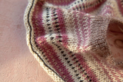 Close-up of human hand in snow