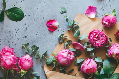 Directly above shot of flowers in envelope on table