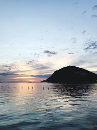 Scenic view of sea against sky at sunset