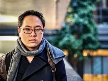 Portrait of young man standing outdoors