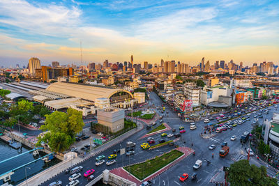 High angle view of city street and buildings against sky