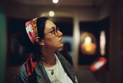 Portrait of young woman looking away