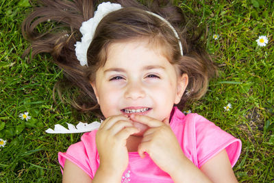 Portrait of a smiling girl on field