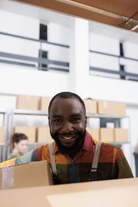 Portrait of young man sitting in office