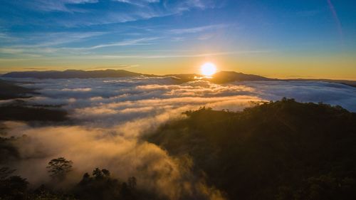 Scenic view of mountains against sky at sunset