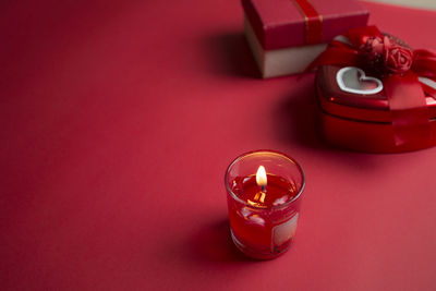 High angle view of illuminated tea light candles on table