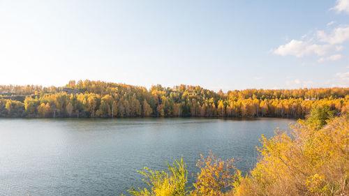 Scenic view of lake against sky during autumn