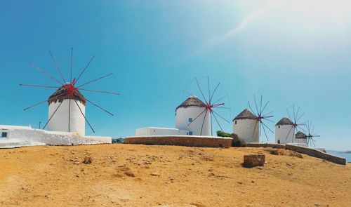 Low angle view of traditional windmill against sky