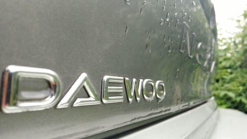 Close-up of car on road