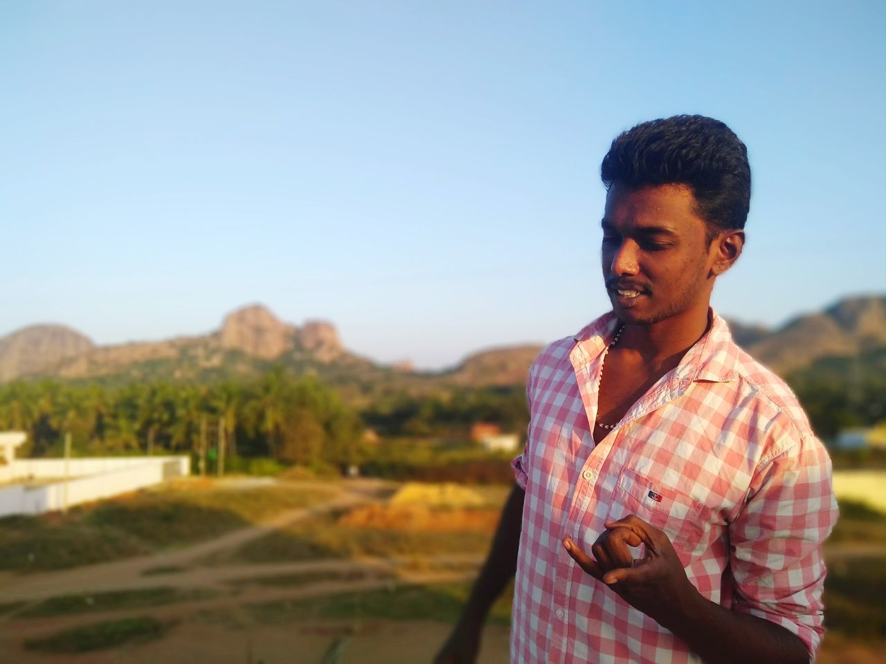 real people, one person, outdoors, focus on foreground, standing, nature, day, young adult, sky