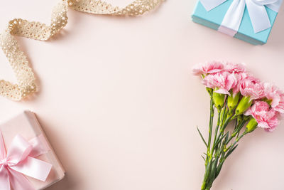 High angle view of pink flower on table