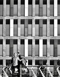 People sitting in front of building