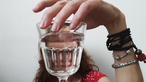 Close-up of hand holding glass of wine