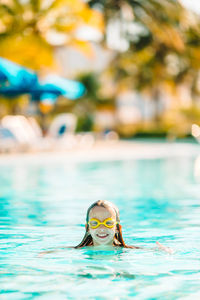 Portrait of person swimming in pool