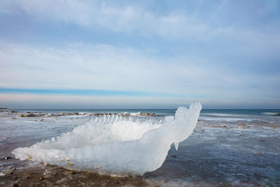 Close-up of wave in sea against sky