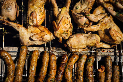 High angle view of meat on barbecue grill