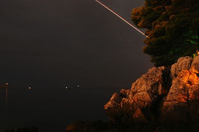 Scenic view of sea against sky at night