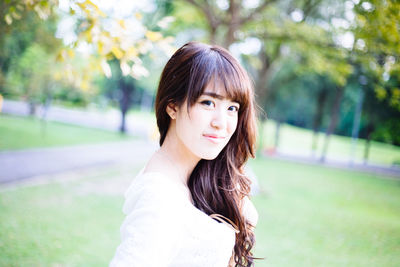 Portrait of young woman standing outdoors