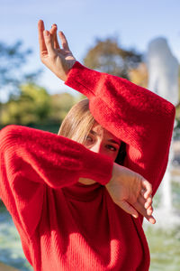 Portrait of woman in red sweater