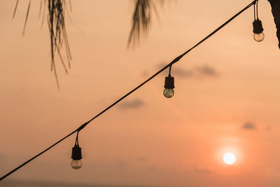 Close-up lighting decoration hanging at beach during sunset