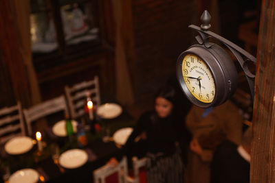 Close-up of clock against wall