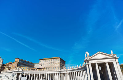 Low angle view of historical building against blue sky