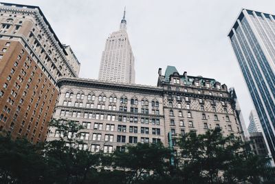 Low angle view of skyscrapers against sky