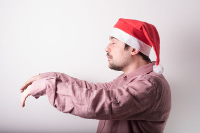 Young man against white background