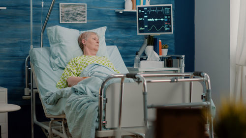 Woman lying on hospital bed