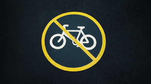 Close-up of no cycling sign on street