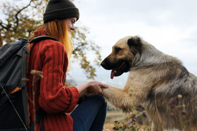 Side view of woman with dog