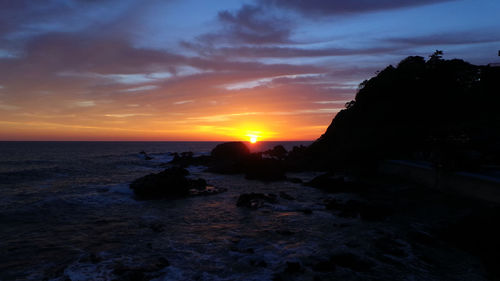 Scenic view of sea against sky during sunset