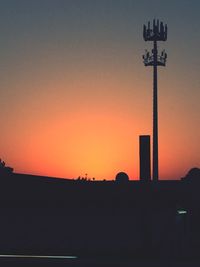 Silhouette landscape against clear sky during sunset