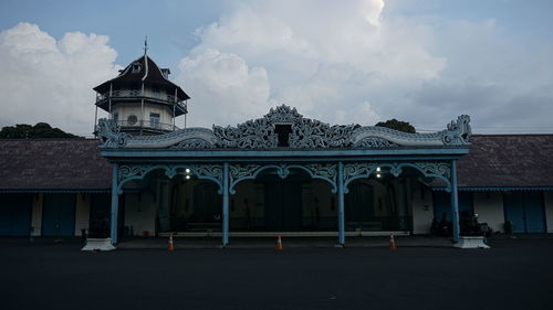 Facade of temple against sky at dusk