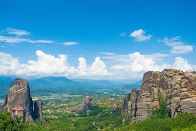 Scenic view of landscape against cloudy sky