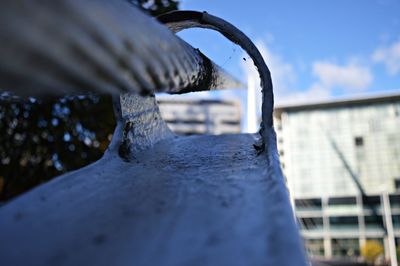 Low angle view of metallic structure against sky