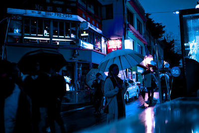 People on street at night