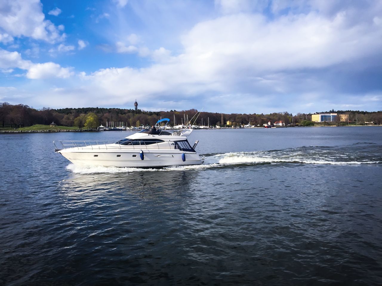 nautical vessel, water, boat, transportation, mode of transport, sky, waterfront, sea, cloud - sky, moored, rippled, cloud, cloudy, nature, tranquil scene, tranquility, building exterior, scenics, beauty in nature, built structure