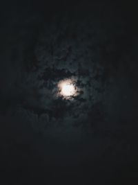 Low angle view of moon in sky at night