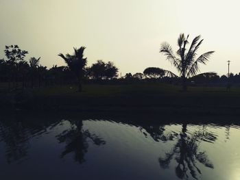 Scenic view of lake against sky at sunset