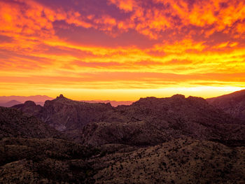 Scenic view of mountains against cloudy sky