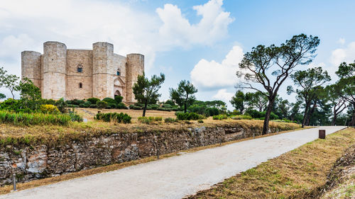 Old ruins by building against sky