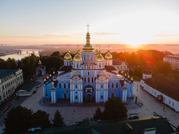 High angle view of buildings against sky at sunset