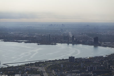 High angle view of cityscape against cloudy sky