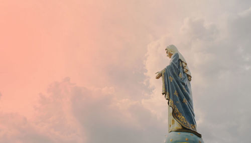 Angle view of statue against sky