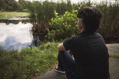 Young woman relaxing at lakeside